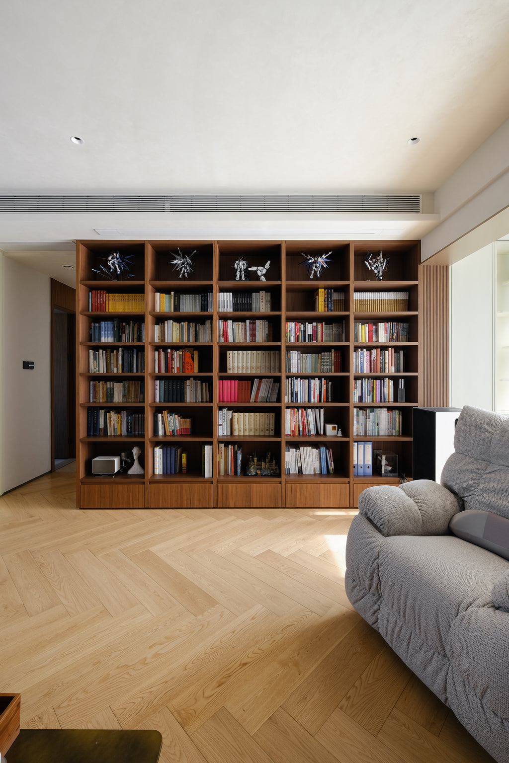 Custom Walnut Library Wall with Integrated Storage