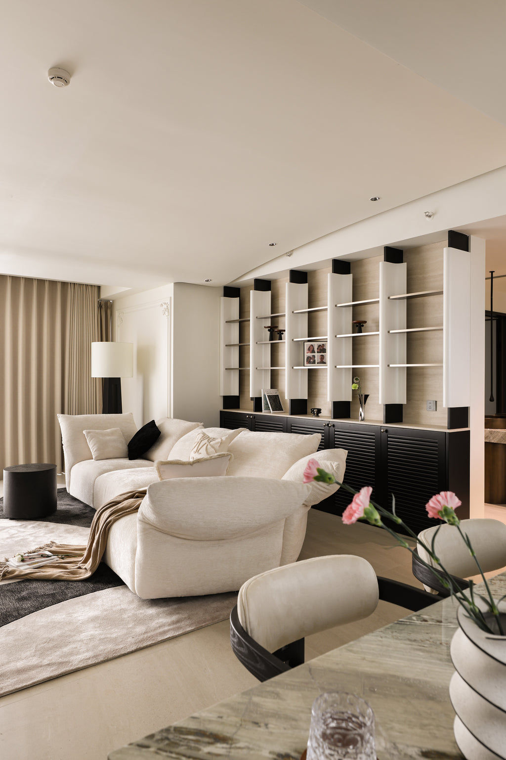 Custom Illuminated Sculptural Shelving Wall with Louvered Base Cabinet