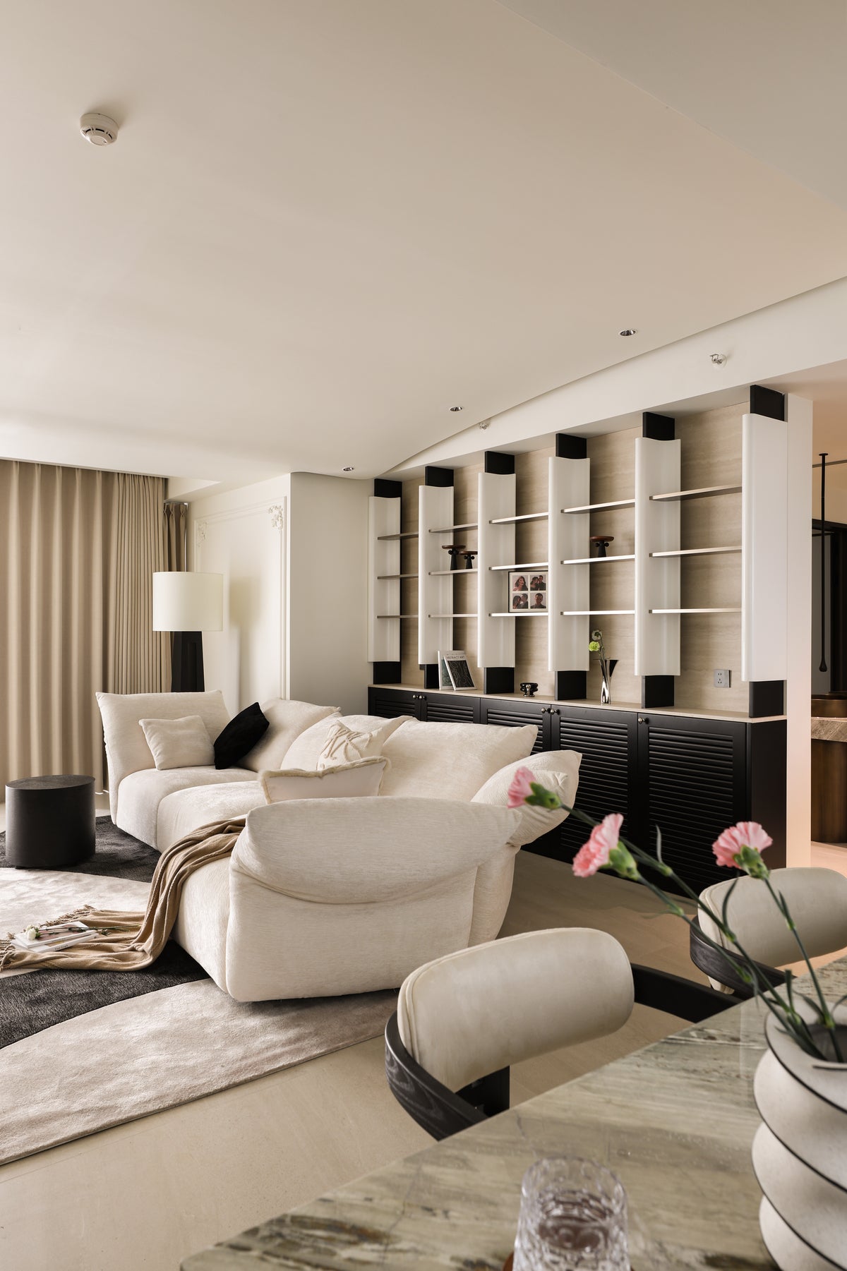 Custom Illuminated Sculptural Shelving Wall with Louvered Base Cabinet