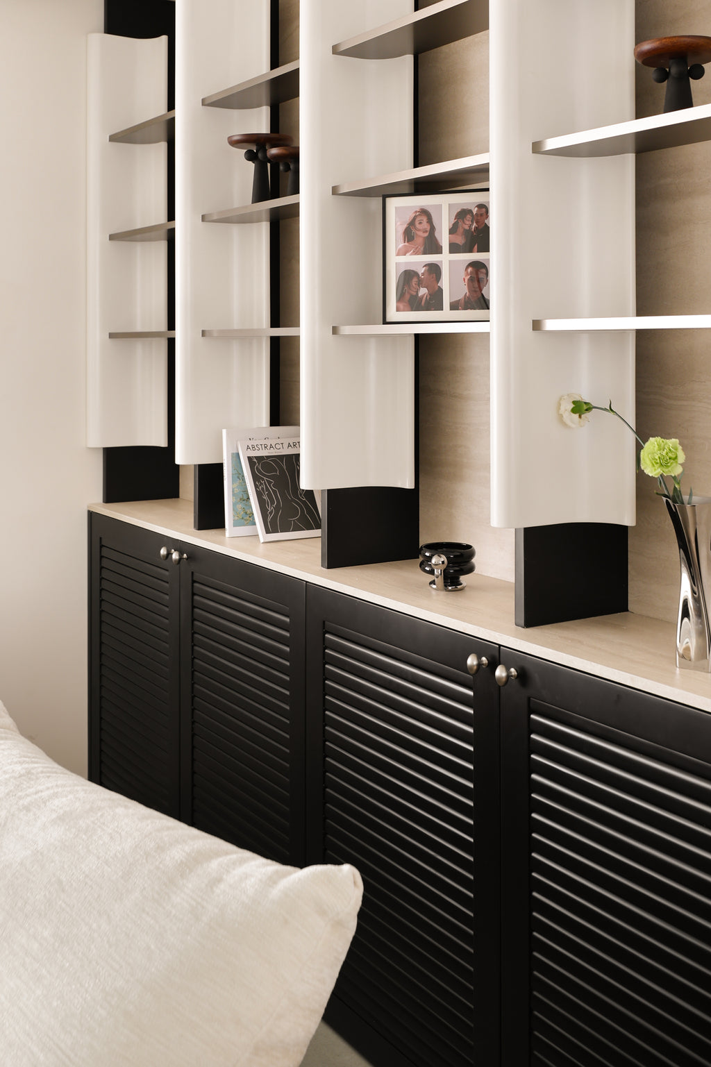 Custom Illuminated Sculptural Shelving Wall with Louvered Base Cabinet